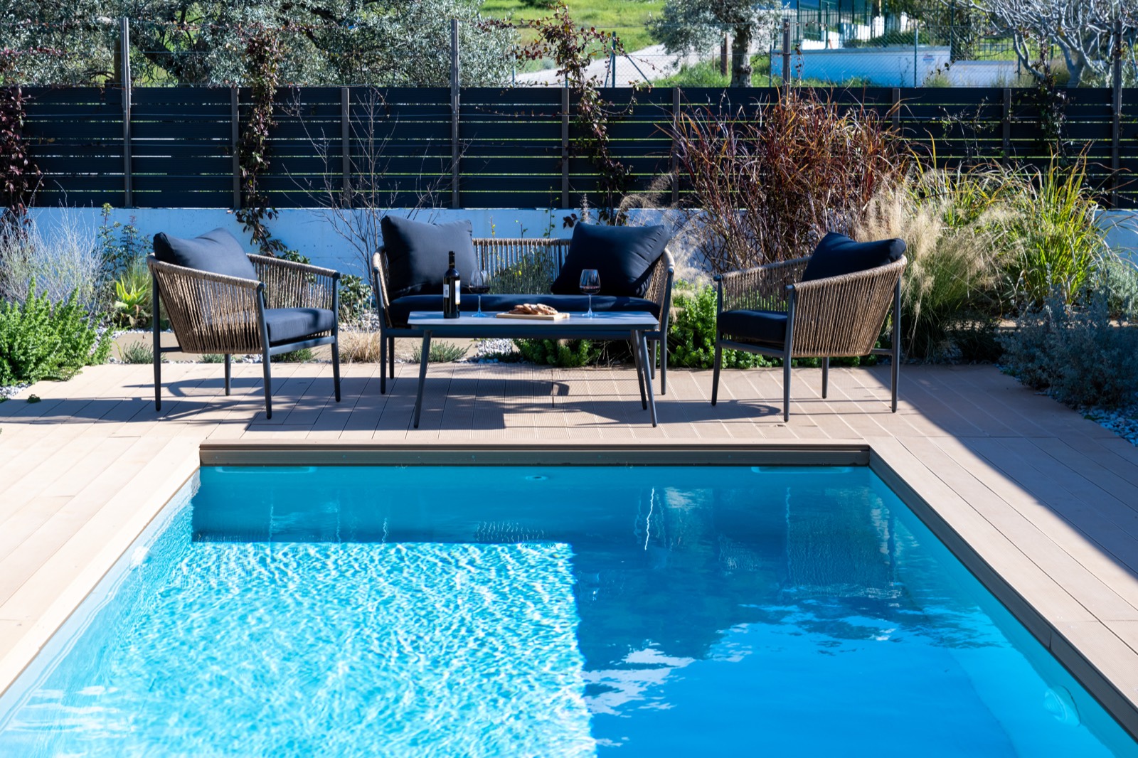 Private pool lounge with seating at a delivered Archray villa